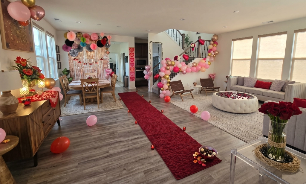Romantic event decor with balloon garlands and rose petal pathway